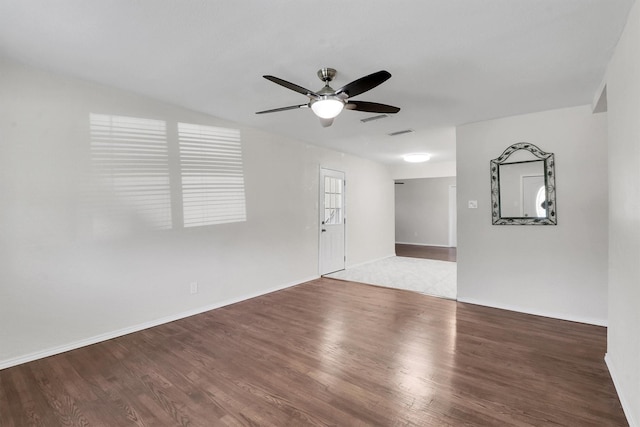 spare room featuring wood-type flooring and ceiling fan