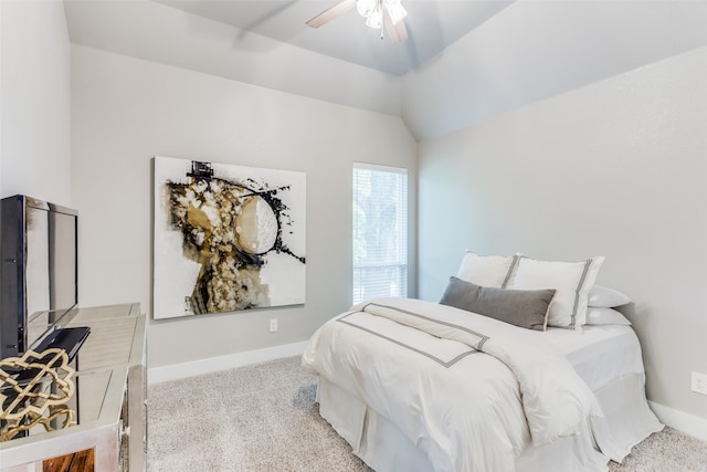 bedroom featuring light carpet, lofted ceiling, and ceiling fan