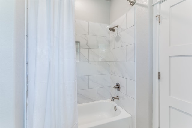 bathroom with shower / tub combo with curtain