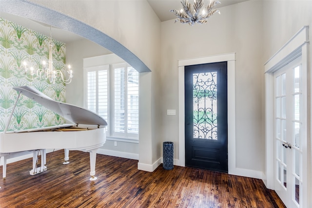 foyer featuring dark hardwood / wood-style flooring and a notable chandelier