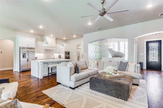 living room with sink, ceiling fan, and hardwood / wood-style floors