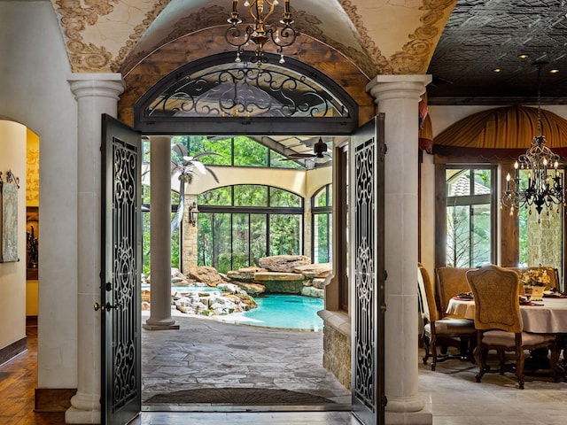 2115 Paradise Ranch Trl, Mckinney, TX 75071 - interior space with an inviting chandelier, arched walkways, and ornate columns