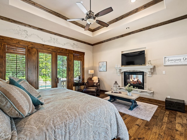 2115 Paradise Ranch Trl, Mckinney, TX 75071 - bedroom with hardwood / wood-style flooring, access to outside, a raised ceiling, and multiple windows