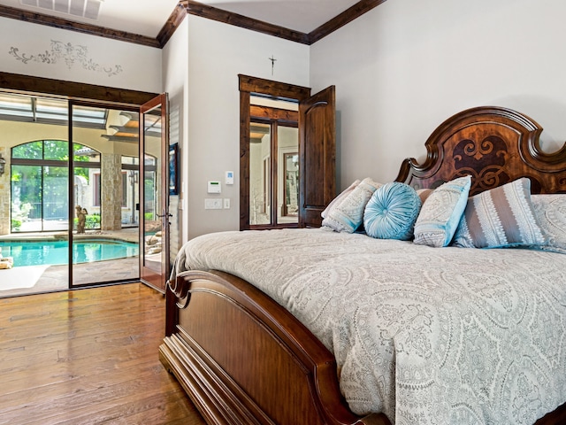 2115 Paradise Ranch Trl, Mckinney, TX 75071 - bedroom with wood-type flooring, visible vents, ornamental molding, and access to exterior
