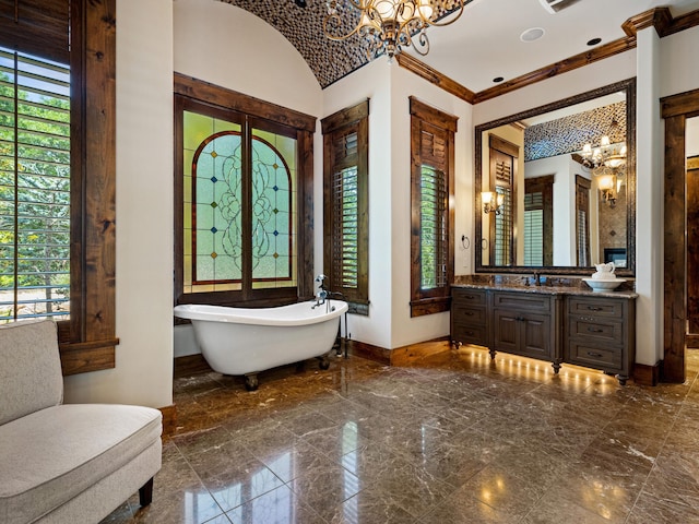 2115 Paradise Ranch Trl, Mckinney, TX 75071 - bathroom with a wealth of natural light, baseboards, an inviting chandelier, and a freestanding bath