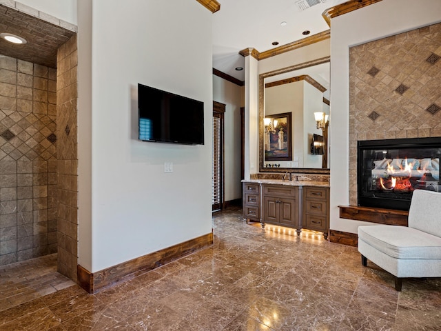 2115 Paradise Ranch Trl, Mckinney, TX 75071 - living room featuring visible vents, a multi sided fireplace, baseboards, and ornamental molding