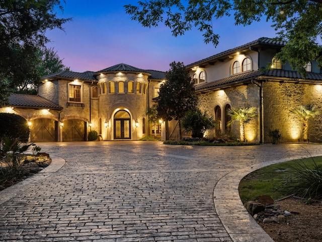 2115 Paradise Ranch Trl, Mckinney, TX 75071 - mediterranean / spanish-style home featuring a tiled roof, french doors, and curved driveway