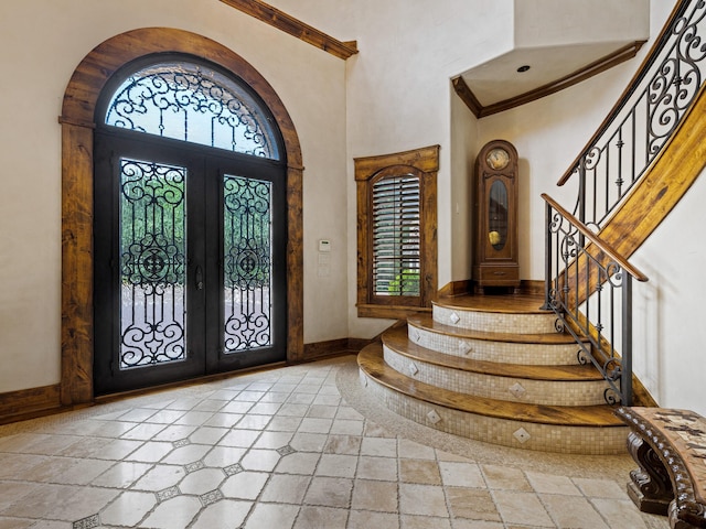 2115 Paradise Ranch Trl, Mckinney, TX 75071 - entrance foyer with a high ceiling, french doors, stairs, and baseboards