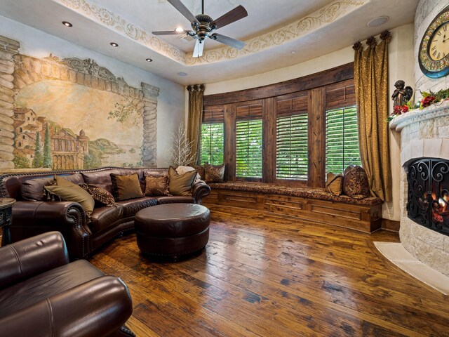 2115 Paradise Ranch Trl, Mckinney, TX 75071 - living room with a fireplace with flush hearth, ceiling fan, hardwood / wood-style flooring, and a wealth of natural light