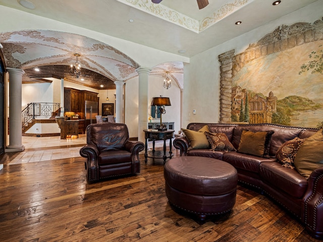 2115 Paradise Ranch Trl, Mckinney, TX 75071 - living area with arched walkways, light wood-type flooring, and ornate columns