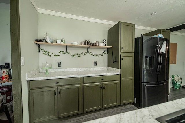 kitchen featuring black fridge with ice dispenser, a textured ceiling, and hardwood / wood-style floors