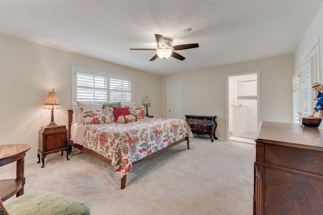 bedroom with light carpet and ceiling fan