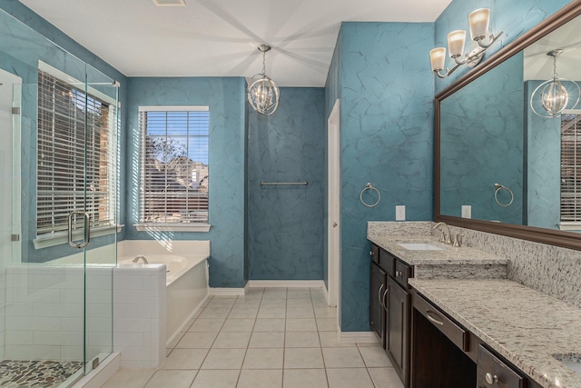 full bathroom with a chandelier, a shower stall, tile patterned floors, and a bath