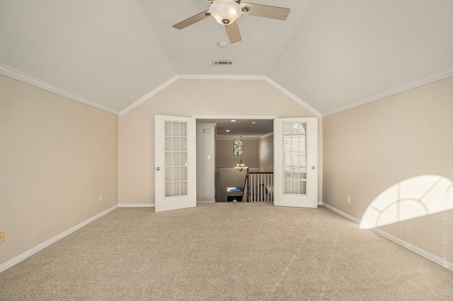 unfurnished room featuring visible vents, lofted ceiling, carpet flooring, french doors, and a ceiling fan