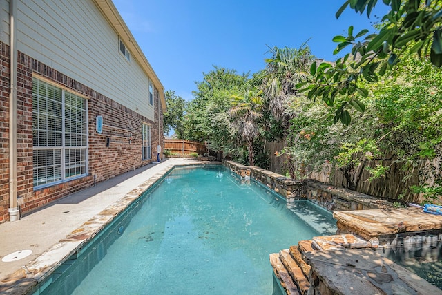 view of pool with pool water feature