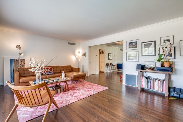 empty room featuring dark hardwood / wood-style floors, beamed ceiling, coffered ceiling, and ornamental molding