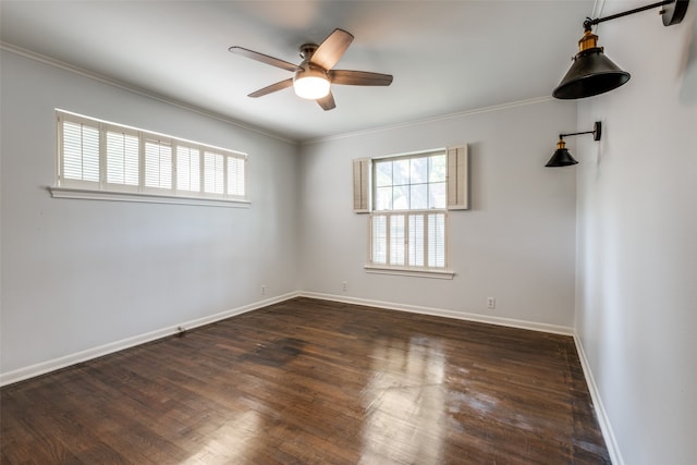 spare room featuring crown molding, dark hardwood / wood-style floors, and ceiling fan