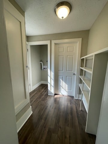 interior space with hardwood / wood-style floors and a textured ceiling