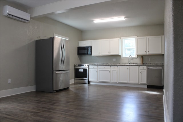 kitchen featuring a wall mounted AC, stainless steel appliances, dark hardwood / wood-style flooring, and white cabinets