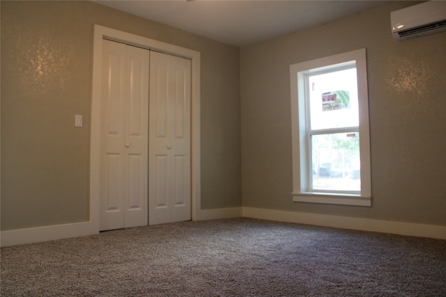 unfurnished bedroom featuring a wall mounted AC, multiple windows, and carpet flooring