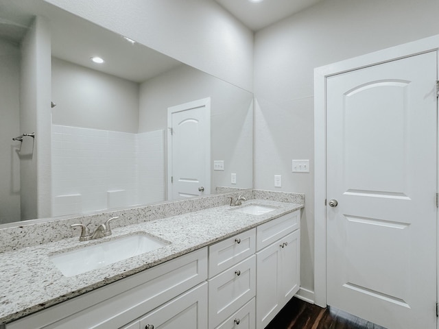 bathroom featuring hardwood / wood-style flooring and vanity