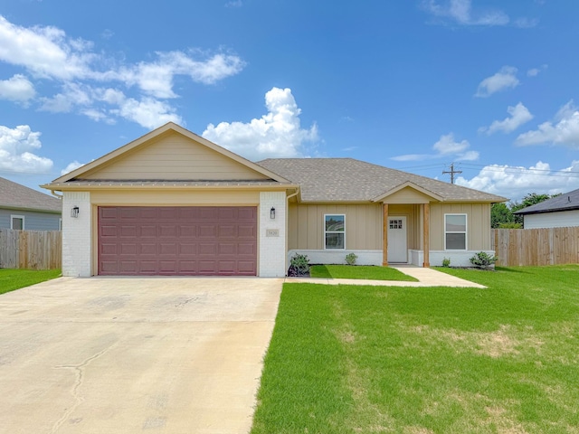 ranch-style house featuring a garage and a front yard