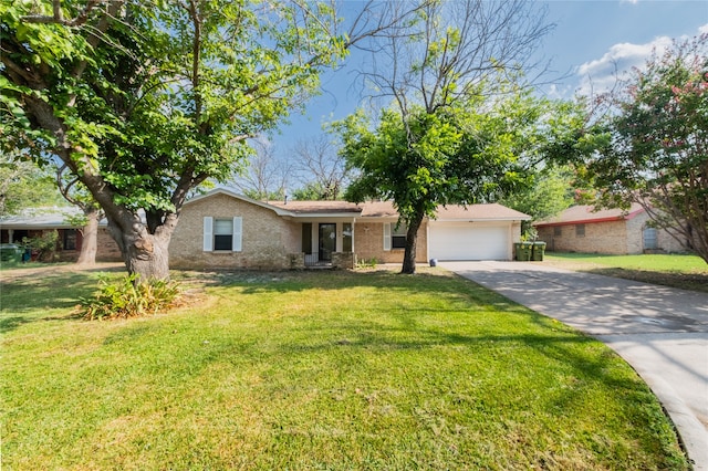 ranch-style house with a garage and a front lawn