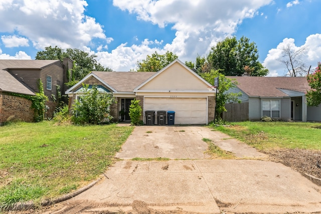 ranch-style home featuring a garage and a front yard