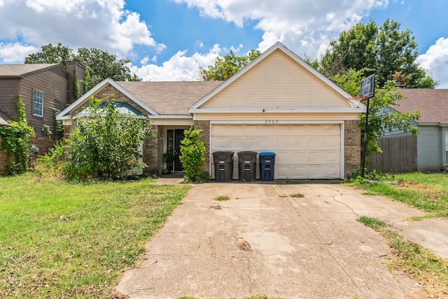 view of front of home featuring a garage and a front lawn