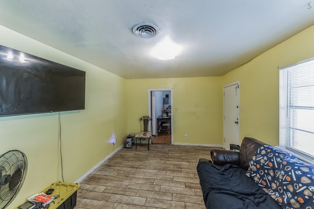 living room featuring a wealth of natural light and light wood-type flooring