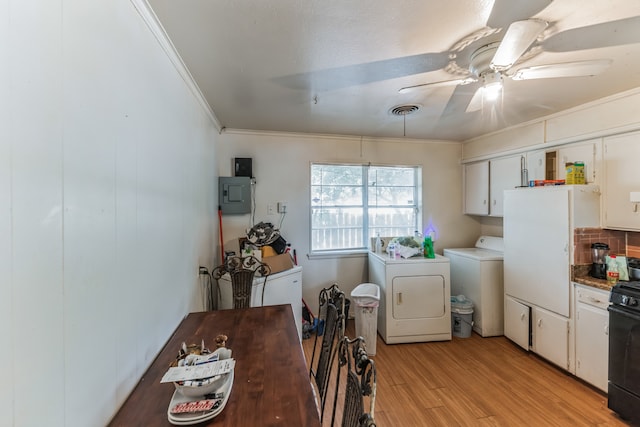 kitchen with white cabinetry, ceiling fan, crown molding, light wood-type flooring, and washing machine and clothes dryer