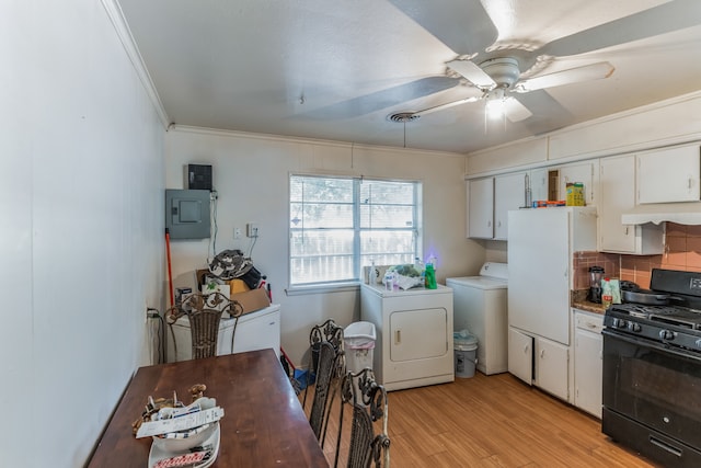 kitchen featuring white cabinetry, ceiling fan, black range with gas stovetop, washing machine and dryer, and light wood-type flooring