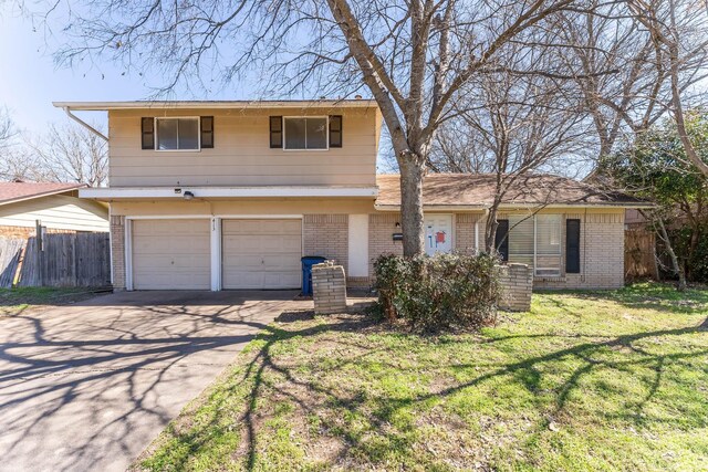 view of front facade with a garage and a front yard