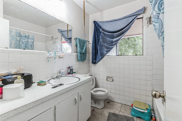 full bathroom featuring backsplash, toilet, vanity, tile walls, and tile patterned floors