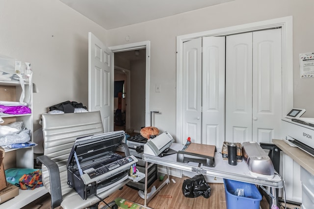 home office with wood-type flooring