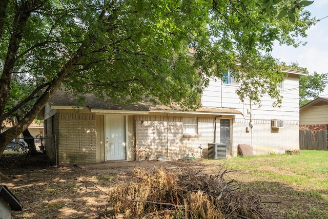 rear view of house with central AC