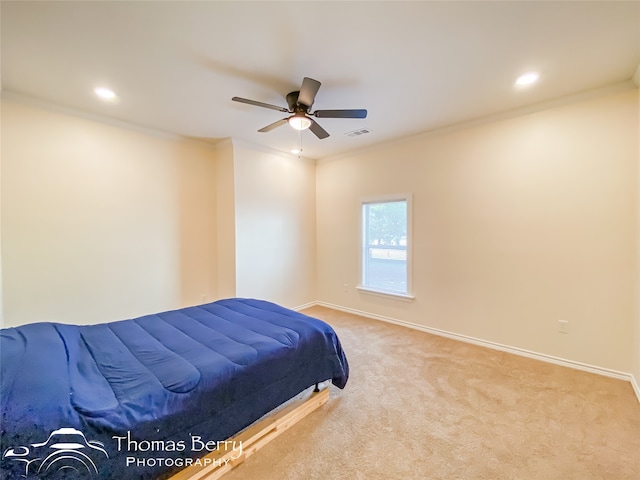 carpeted bedroom with ceiling fan