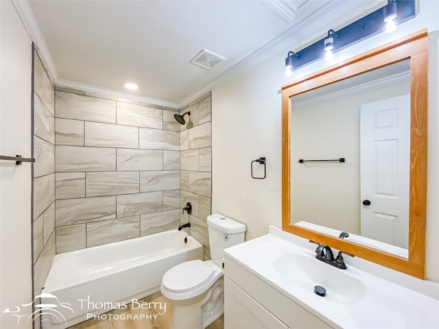 full bathroom with vanity, ornamental molding, tiled shower / bath combo, and toilet