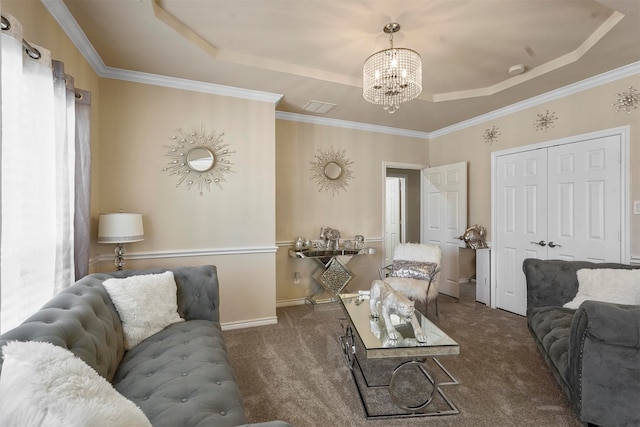 carpeted living room with a notable chandelier, crown molding, and a tray ceiling