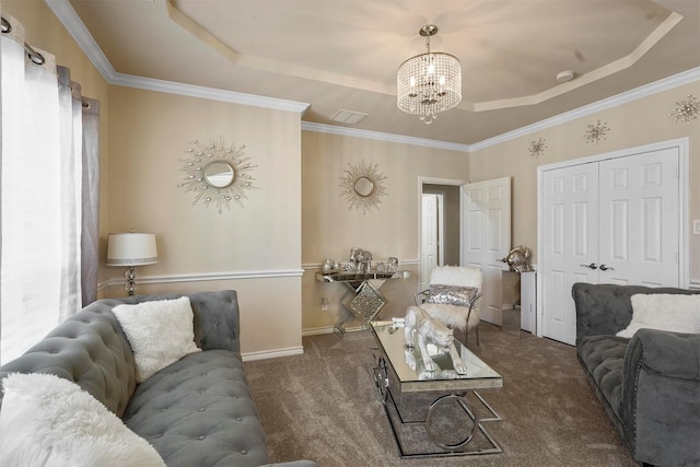 living room featuring crown molding, a chandelier, dark carpet, and a tray ceiling