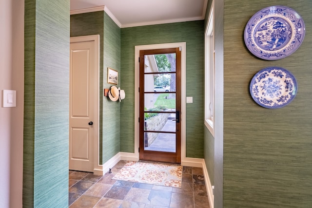 tiled foyer featuring ornamental molding