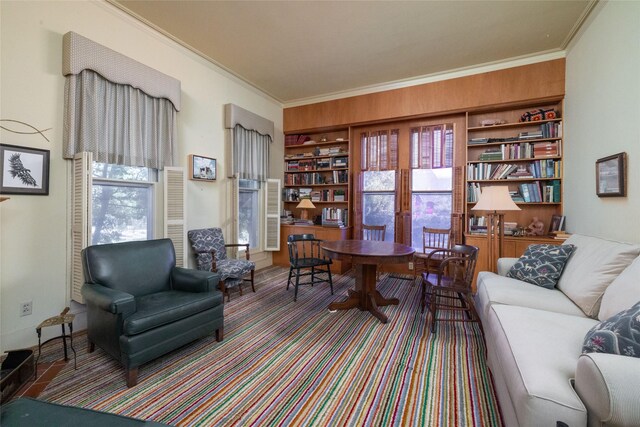 office space with plenty of natural light, built in features, and crown molding