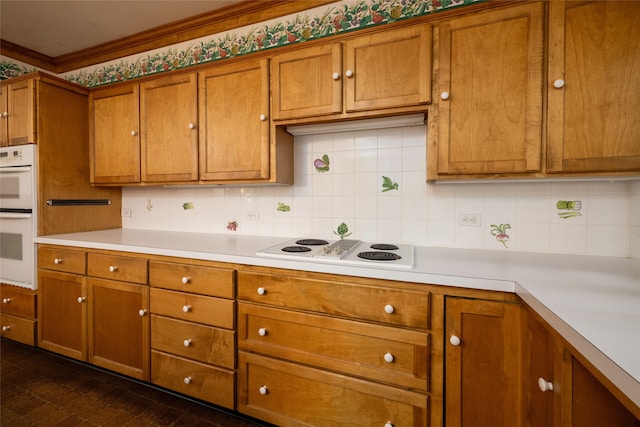 kitchen featuring backsplash and white appliances