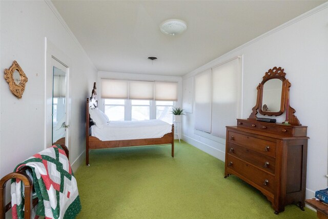 carpeted bedroom featuring crown molding