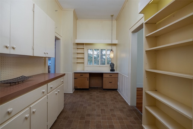 kitchen featuring dark hardwood / wood-style floors, decorative light fixtures, and white cabinetry