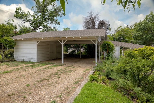 view of vehicle parking featuring a carport