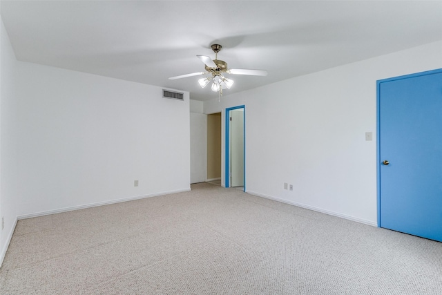 spare room featuring ceiling fan and carpet flooring