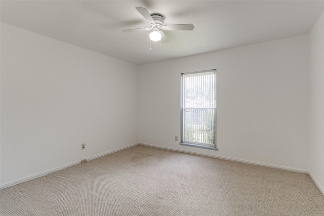 empty room featuring ceiling fan and carpet floors