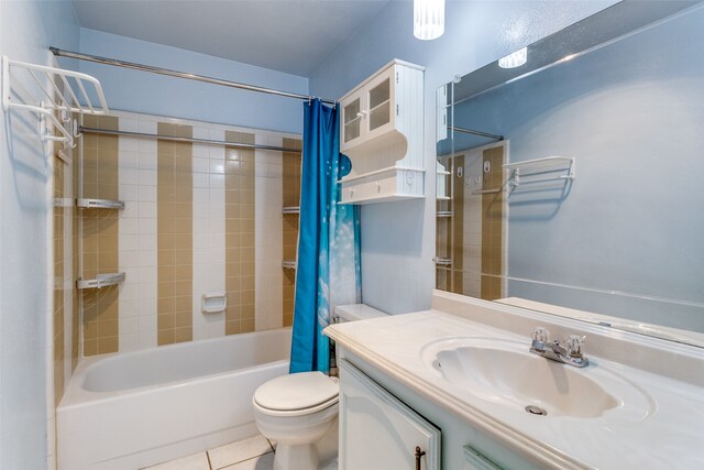 full bathroom with vanity, tile patterned floors, toilet, and shower / bath combination with curtain