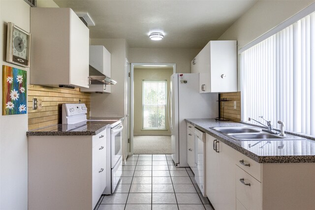 kitchen with backsplash, sink, wall chimney exhaust hood, and white electric range oven